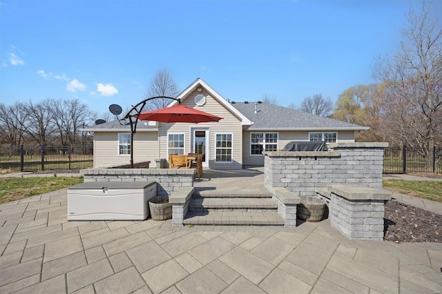 back of house featuring a patio area and fence