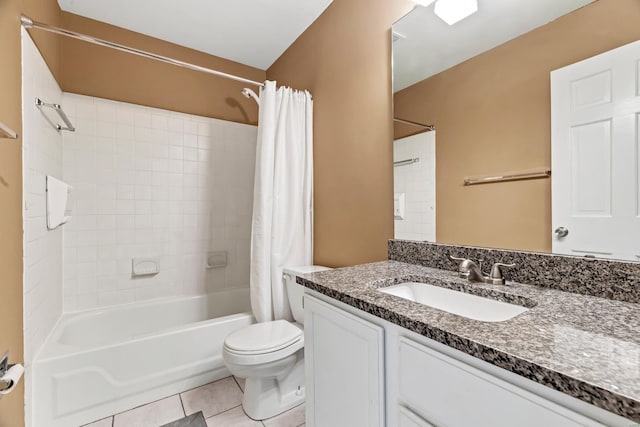 bathroom featuring shower / bath combination with curtain, vanity, toilet, and tile patterned floors