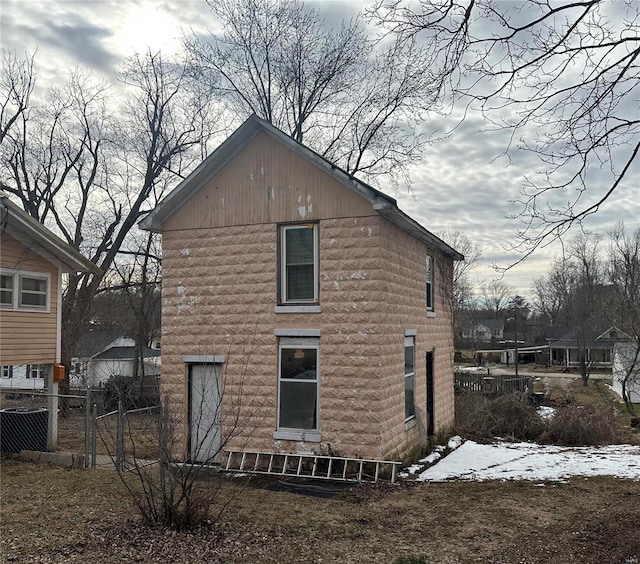 rear view of property with fence