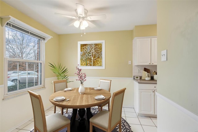 dining room featuring light tile patterned floors and a ceiling fan