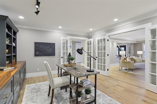 dining area featuring crown molding, baseboards, recessed lighting, french doors, and light wood-style floors