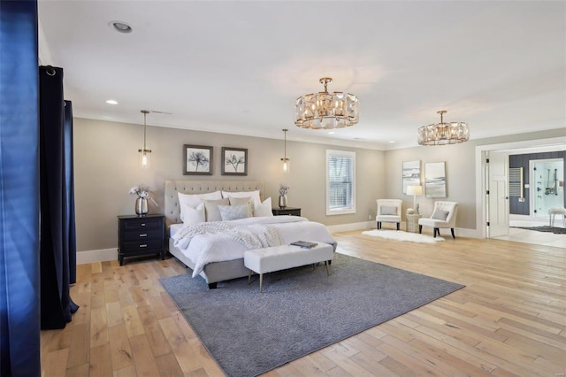 bedroom featuring an inviting chandelier, light wood-style flooring, recessed lighting, and baseboards