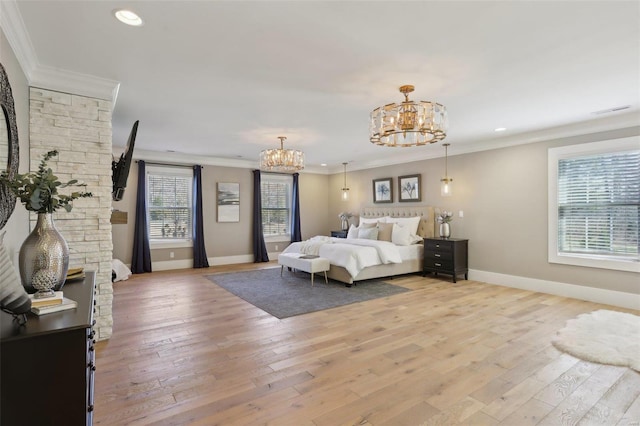 bedroom featuring light wood-style flooring, baseboards, a notable chandelier, and ornamental molding