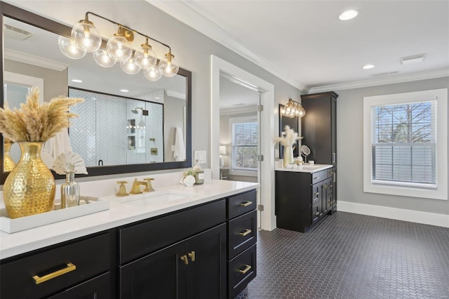 bathroom featuring crown molding, two vanities, a stall shower, and a sink