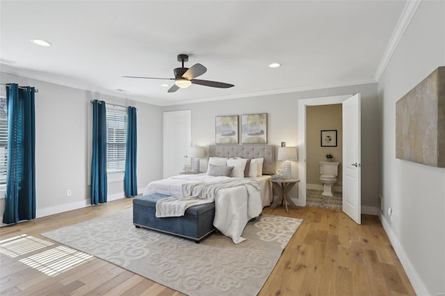 bedroom featuring light wood-type flooring, baseboards, and crown molding