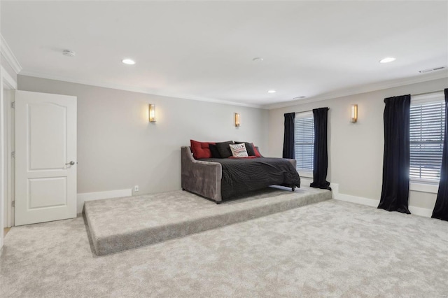 carpeted bedroom with recessed lighting, visible vents, baseboards, and crown molding