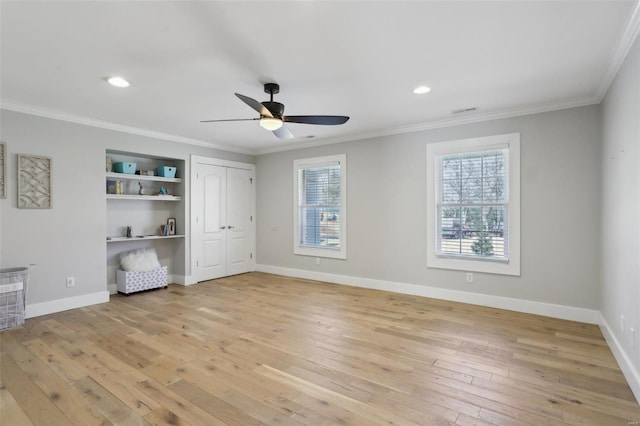 unfurnished bedroom with baseboards, crown molding, and light wood finished floors