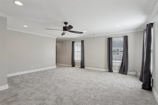 unfurnished room with light colored carpet, baseboards, and ornamental molding