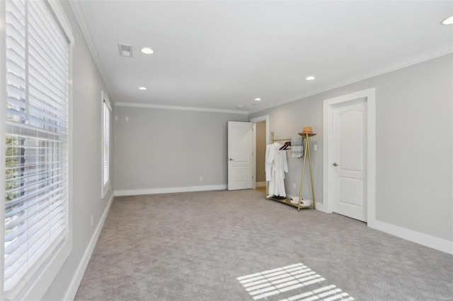 unfurnished bedroom featuring recessed lighting, multiple windows, baseboards, and ornamental molding