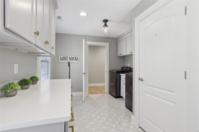 kitchen with visible vents, baseboards, washing machine and dryer, light countertops, and recessed lighting