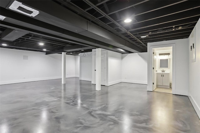 finished basement featuring baseboards