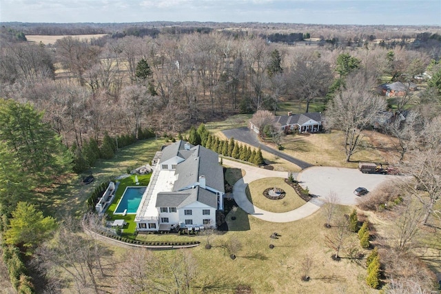 drone / aerial view with a view of trees