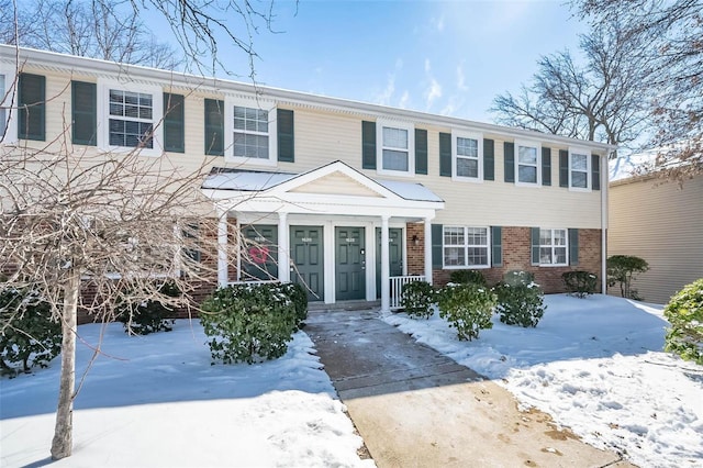 view of front of house featuring brick siding