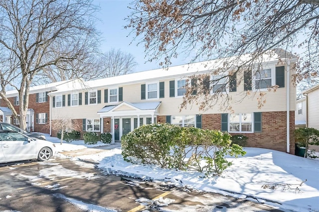 view of front facade featuring brick siding