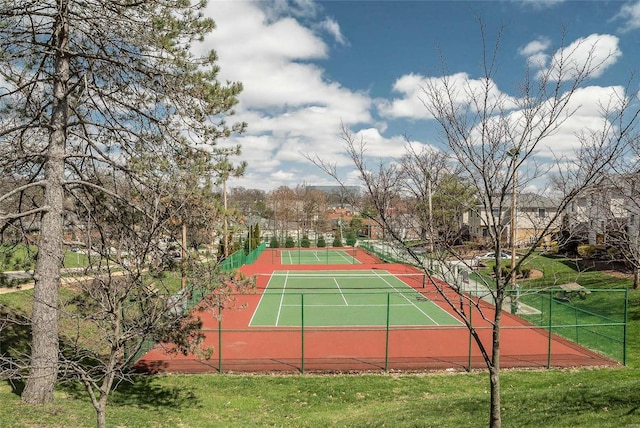 view of tennis court with fence