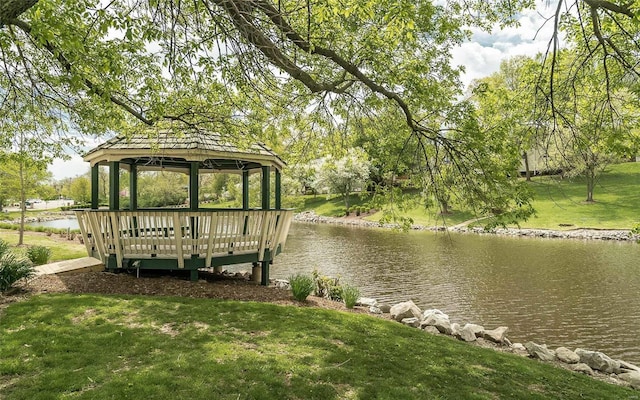 view of dock featuring a water view, a yard, and a gazebo