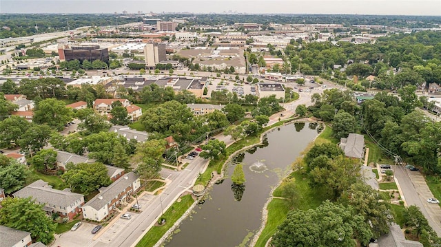 birds eye view of property with a water view and a residential view