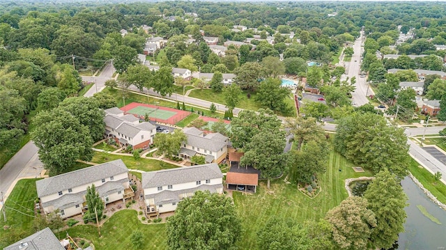 birds eye view of property with a residential view and a water view