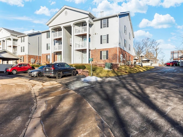 view of property featuring uncovered parking