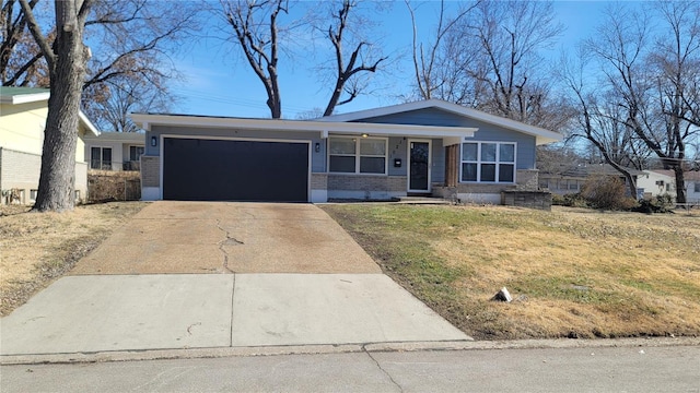 view of front of property with driveway, brick siding, and an attached garage