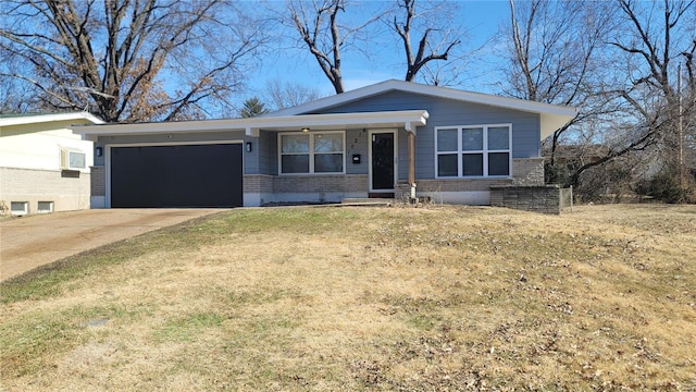 view of front of house with an attached garage, brick siding, driveway, and a front lawn