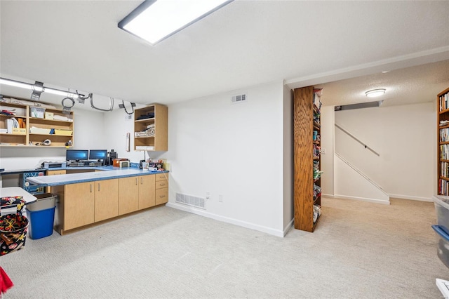 kitchen with light colored carpet, light brown cabinetry, visible vents, and open shelves