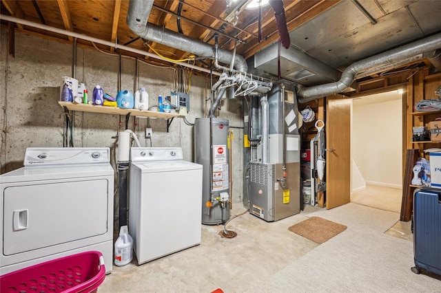 unfinished below grade area featuring independent washer and dryer, gas water heater, and heating unit