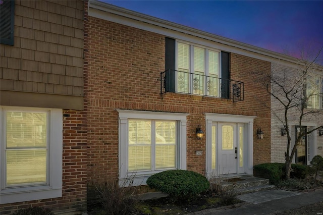 exterior space featuring brick siding