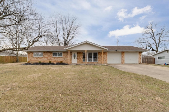 ranch-style home featuring an attached garage, fence, a front lawn, and concrete driveway