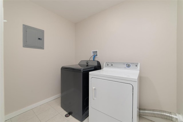 washroom with washer and clothes dryer, light tile patterned flooring, laundry area, electric panel, and baseboards