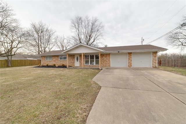 ranch-style house featuring a garage, fence, concrete driveway, and a front yard