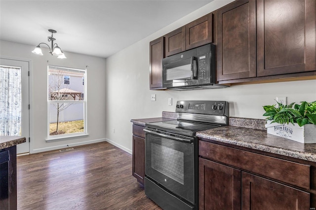 kitchen featuring dark countertops, dark wood-style flooring, dark brown cabinets, and black appliances