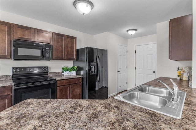 kitchen featuring a sink, black appliances, and dark brown cabinets