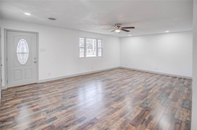 foyer featuring baseboards, wood finished floors, and recessed lighting