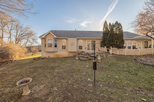 ranch-style house with a front lawn