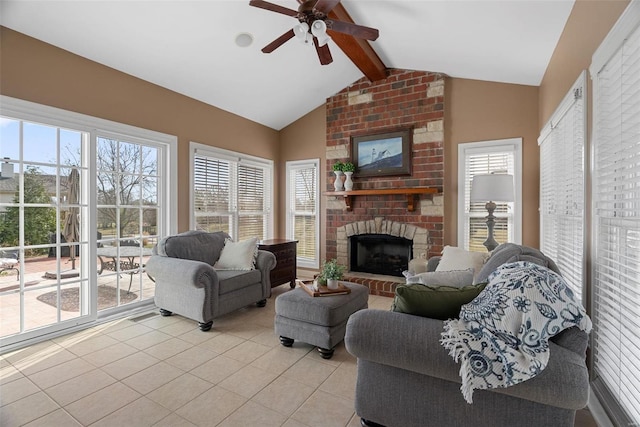 living room with lofted ceiling with beams, a brick fireplace, light tile patterned floors, and a ceiling fan