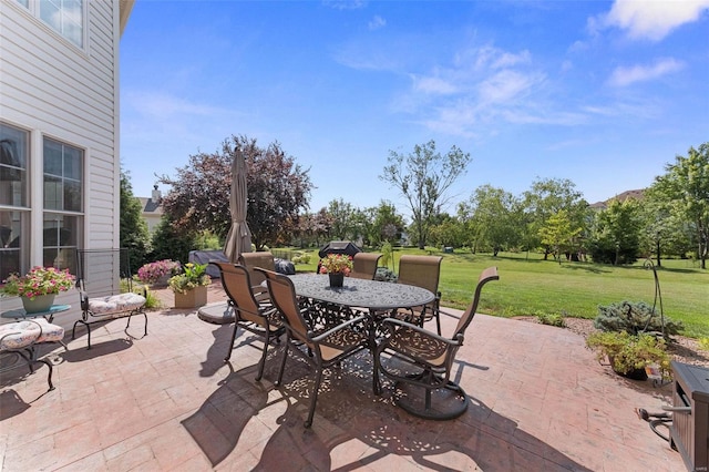 view of patio featuring outdoor dining area