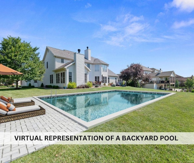 pool featuring a yard and a patio area