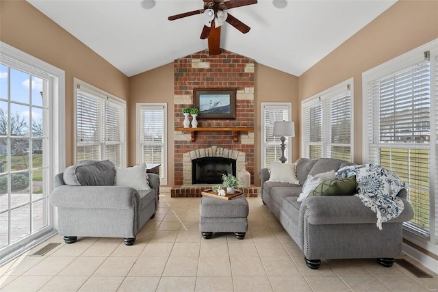 living room with light tile patterned floors, visible vents, vaulted ceiling with beams, and ceiling fan