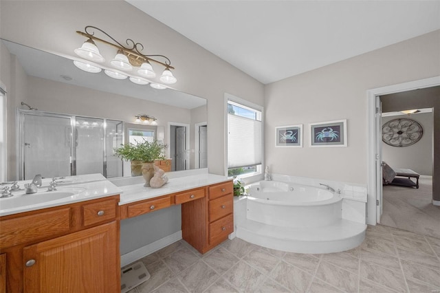 ensuite bathroom with vanity, a stall shower, ensuite bathroom, tile patterned floors, and a jetted tub