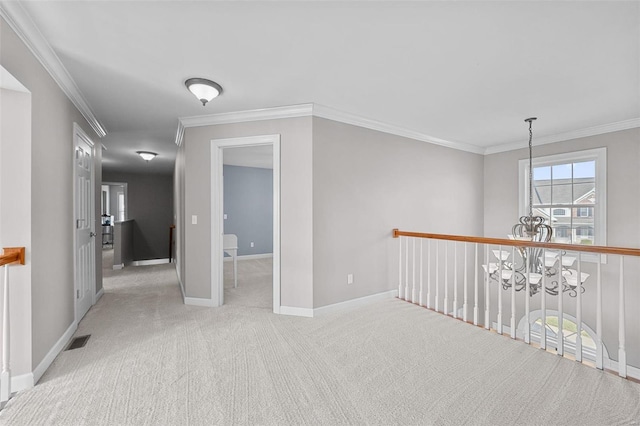 hall featuring carpet flooring, baseboards, visible vents, and ornamental molding