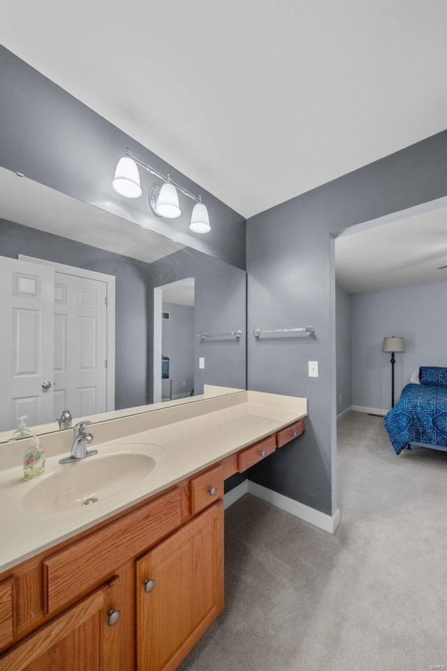 bathroom with vanity and baseboards