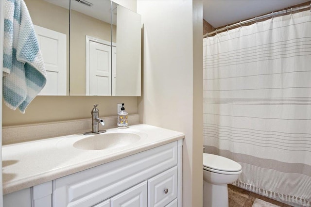 full bath with toilet and vanity