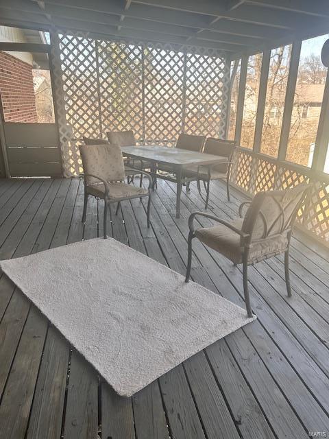 wooden terrace featuring outdoor dining area