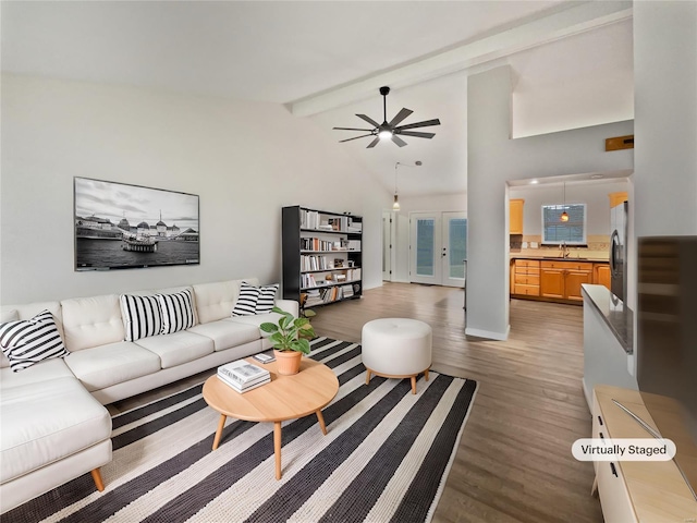 living area with ceiling fan, french doors, light wood-type flooring, high vaulted ceiling, and beam ceiling