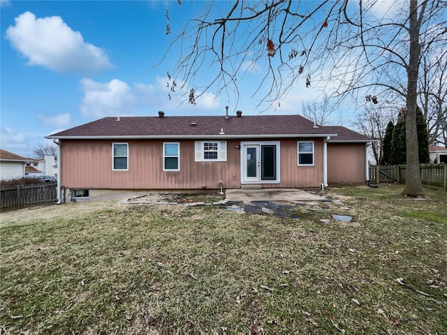 rear view of house featuring a patio area, a fenced backyard, and a lawn