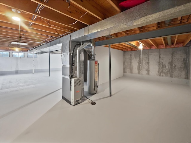 basement with gas water heater and heating unit