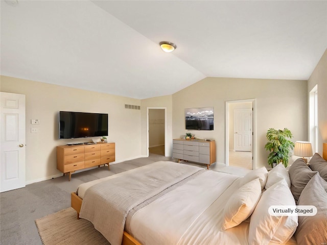 bedroom with lofted ceiling, baseboards, visible vents, and carpet flooring