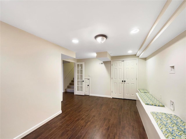 interior space with recessed lighting, dark wood finished floors, stairway, and baseboards