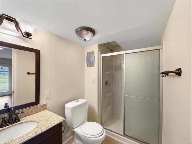 full bath featuring toilet, a shower stall, visible vents, and vanity